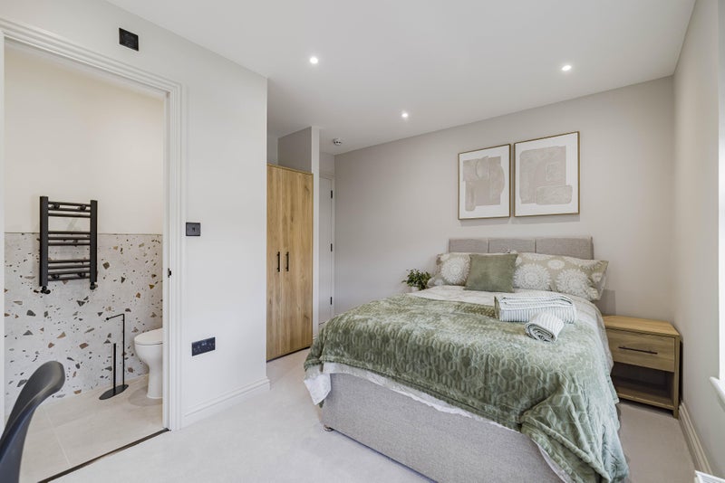 A furnished en-suite bedroom at Your Manor